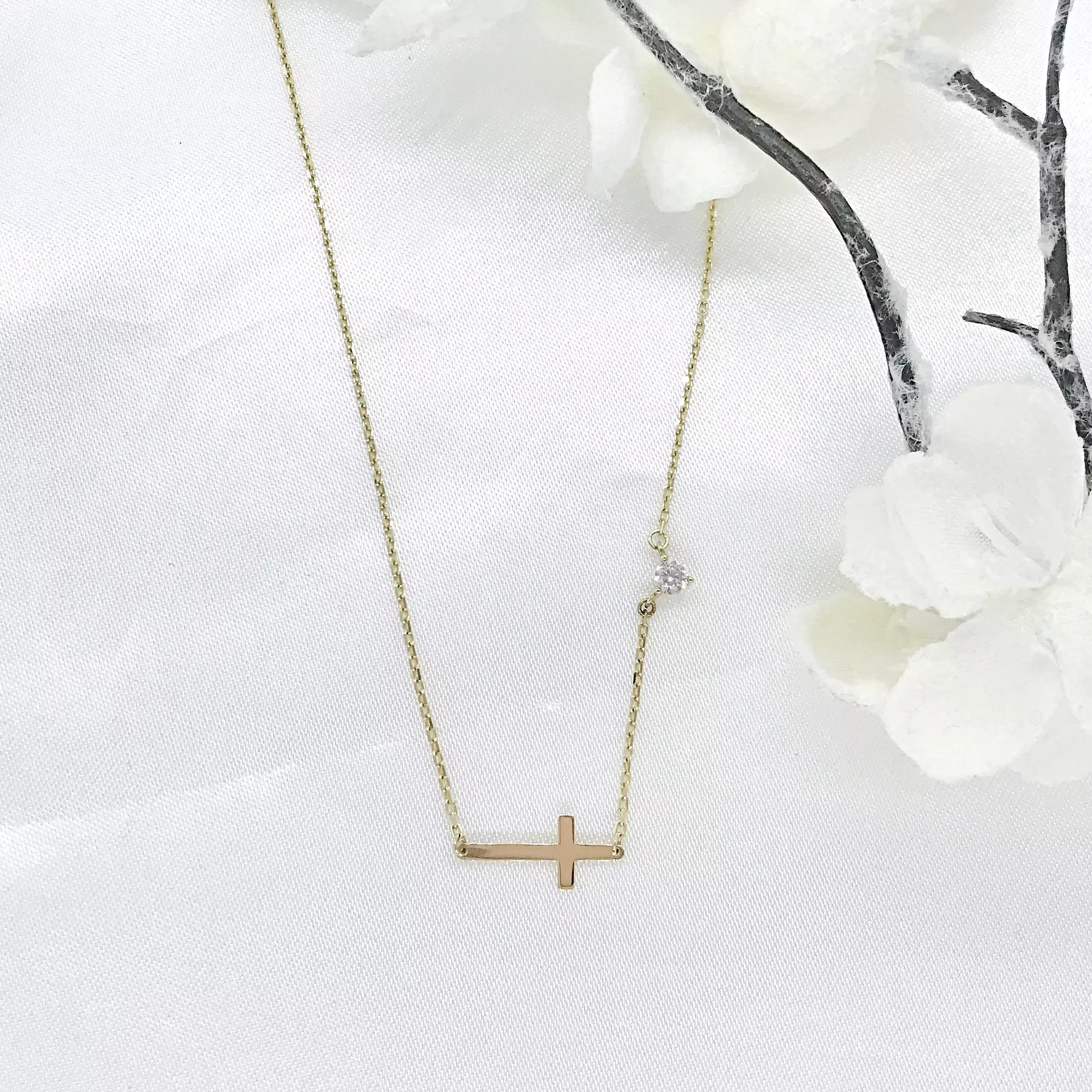 10K Gold Sideways Cross Necklace with CZ