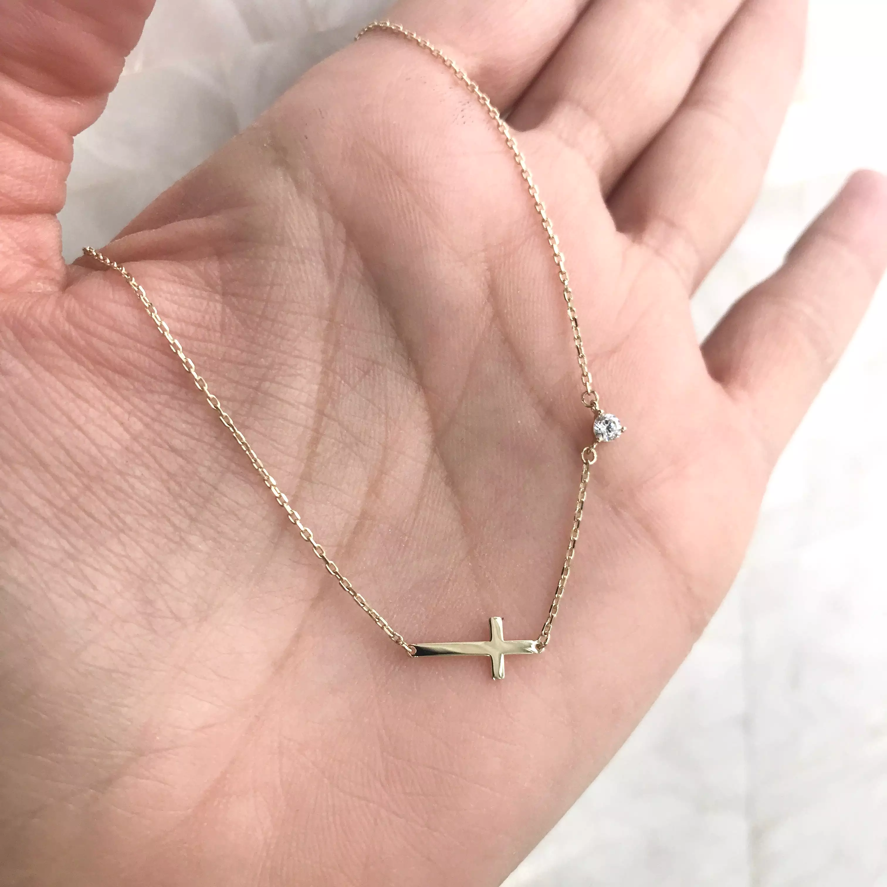 10K Gold Sideways Cross Necklace with CZ