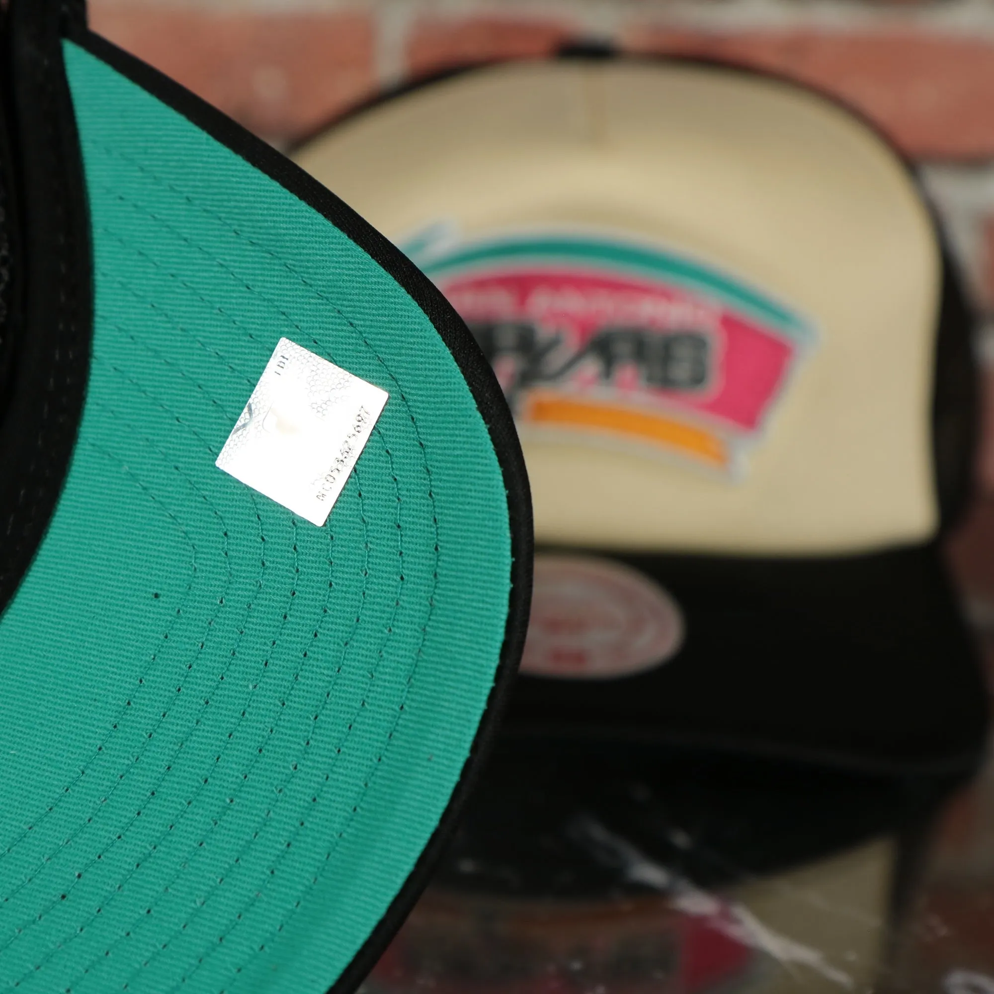 San Antonio Spurs Spurs wordmark teal Bottom 2-Tone Foam Trucker Hat | Black/Off-White Mitchell and Ness Hat