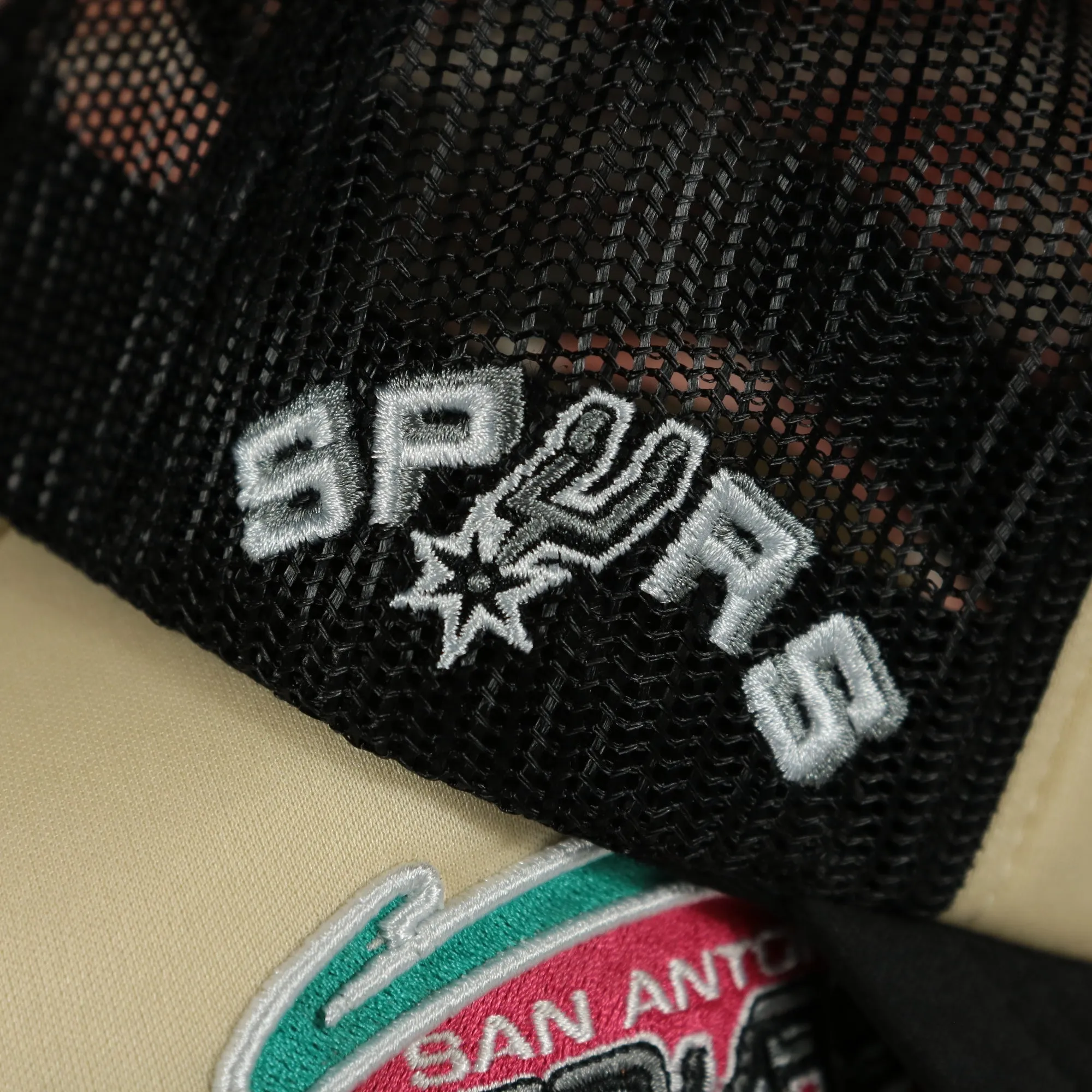 San Antonio Spurs Spurs wordmark teal Bottom 2-Tone Foam Trucker Hat | Black/Off-White Mitchell and Ness Hat